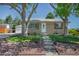 Charming one-story home featuring a well-maintained lawn, mature trees, and inviting front entrance at 1229 W 102Nd Ave, Northglenn, CO 80260