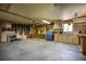 Spacious garage with ample storage cabinets and work area at 1229 W 102Nd Ave, Northglenn, CO 80260