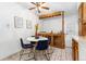 A cozy kitchen with tile floors, wooden cabinets, and a breakfast nook with seating at 1229 W 102Nd Ave, Northglenn, CO 80260