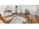 Comfortable and stylish living room with hardwood floors, bright accents, and easy access to kitchen at 1229 W 102Nd Ave, Northglenn, CO 80260