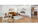Inviting living room boasts hardwood floors, a cozy couch, and decorative accents at 1229 W 102Nd Ave, Northglenn, CO 80260