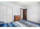 Spacious bedroom with a double bed and ample closet space at 7309 W Hampden Ave # 402, Lakewood, CO 80227