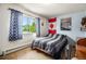 Bright bedroom featuring a double bed and a window with natural light at 7309 W Hampden Ave # 402, Lakewood, CO 80227