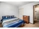 Well-lit bedroom offering a double bed and built-in wardrobe at 7309 W Hampden Ave # 402, Lakewood, CO 80227