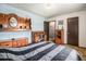 Cozy bedroom with double bed, dresser, and built-in shelving at 7309 W Hampden Ave # 402, Lakewood, CO 80227