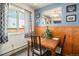 Dining area with wood table and chairs, window view at 7309 W Hampden Ave # 402, Lakewood, CO 80227