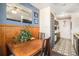 Dining area with wood table and chairs, kitchen view at 7309 W Hampden Ave # 402, Lakewood, CO 80227