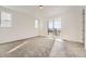 Bright and spacious bedroom with carpet, white walls, and sliding glass door at 918 Congress Pl, Elizabeth, CO 80107