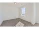 Cozy bedroom features neutral walls, carpet, and a window providing natural light at 918 Congress Pl, Elizabeth, CO 80107