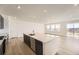 Kitchen featuring stainless appliances, light countertops and an island, and an open concept floor plan and light wood floors at 918 Congress Pl, Elizabeth, CO 80107