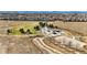 An aerial view of the neighborhood park and playground surrounded by walking paths and fields at 618 S Carlton St, Castle Rock, CO 80104