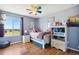 Bright and airy bedroom with colorful accents, large window and hardwood floors at 618 S Carlton St, Castle Rock, CO 80104