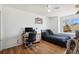 Well-lit bedroom featuring hardwood floors, a desk, and a window with natural light at 618 S Carlton St, Castle Rock, CO 80104