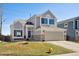 Charming two-story home featuring a two-car garage, stone accents, and well-maintained landscaping at 618 S Carlton St, Castle Rock, CO 80104