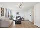 Comfortable living room with tile flooring, neutral tones, and ample natural light at 618 S Carlton St, Castle Rock, CO 80104