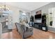 Cozy living room features a large window, hardwood floors, fireplace, and ample natural light at 618 S Carlton St, Castle Rock, CO 80104