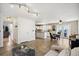 Bright living area showcasing tile floors, an open layout, and a modern kitchen in the background at 618 S Carlton St, Castle Rock, CO 80104