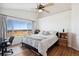 Spacious main bedroom with hardwood floors, a large window, and comfortable furnishings at 618 S Carlton St, Castle Rock, CO 80104