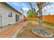 Outdoor patio with seating and a large tree providing shade at 5224 Scranton Ct, Denver, CO 80239