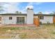 Backyard features patio, seating, and a well-maintained lawn at 5224 Scranton Ct, Denver, CO 80239