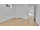 Finished basement room featuring wood-look floors and closet at 5224 Scranton Ct, Denver, CO 80239
