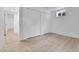 Finished basement room featuring wood-look floors and closet space at 5224 Scranton Ct, Denver, CO 80239