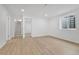 Finished basement room with wood-look floors and staircase to upper level at 5224 Scranton Ct, Denver, CO 80239