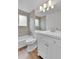 Updated bathroom features new vanity, fixtures, and tile in shower/tub at 5224 Scranton Ct, Denver, CO 80239