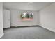 This bedroom is freshly painted, features a neutral carpet, and has a bright window at 5224 Scranton Ct, Denver, CO 80239