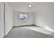 This bedroom is freshly painted, features a neutral carpet, and has a nice window at 5224 Scranton Ct, Denver, CO 80239