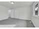 This bedroom is freshly painted, features a neutral carpet, and has a closet and window at 5224 Scranton Ct, Denver, CO 80239