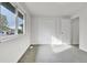 Cozy bedroom features fresh paint and carpeting, with a window and closet at 5224 Scranton Ct, Denver, CO 80239
