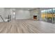 Bright, open living room featuring a stone fireplace and sliding glass doors to outdoor area at 5224 Scranton Ct, Denver, CO 80239