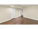 Finished basement with laminate floors and white doors at 12790 Jackson St, Thornton, CO 80241