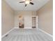Bright bedroom featuring neutral walls and a door leading to an organized closet at 12790 Jackson St, Thornton, CO 80241