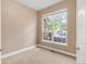 Cozy bedroom with carpet and large window with backyard view at 12790 Jackson St, Thornton, CO 80241