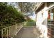 Exterior deck featuring white railings and mature trees at 12790 Jackson St, Thornton, CO 80241