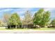 Inviting home exterior with lush green lawn and mature trees providing shade and curb appeal at 12790 Jackson St, Thornton, CO 80241