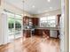 Well-lit kitchen with stainless appliances, cherry cabinets, and a sliding door to the deck at 12790 Jackson St, Thornton, CO 80241