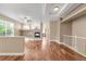 Spacious living room featuring hardwood floors, fireplace, and seamless flow to adjacent rooms at 12790 Jackson St, Thornton, CO 80241