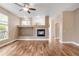 Cozy living room boasts hardwood floors, a warm fireplace, and a comfortable atmosphere at 12790 Jackson St, Thornton, CO 80241