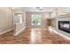 Bright living space with hardwood floors, fireplace, and open layout for easy entertaining at 12790 Jackson St, Thornton, CO 80241