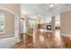 Inviting living room with hardwood floors, fireplace, and abundant natural light at 12790 Jackson St, Thornton, CO 80241