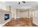 Hardwood floors and a cozy fireplace create an inviting space in the naturally lit living room at 12790 Jackson St, Thornton, CO 80241