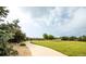 Scenic park view featuring a walking path, open green space, mature trees, and peaceful surroundings at 12790 Jackson St, Thornton, CO 80241