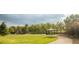 Community park featuring a playground, picnic shelter, open green space, and walking path at 12790 Jackson St, Thornton, CO 80241