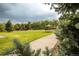 Lush community park with a playground, picnic shelter, and walking path surrounded by trees at 12790 Jackson St, Thornton, CO 80241