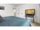 Bedroom featuring neutral walls, plush carpet, and a modern television at 3074 Belleville Ridge Rd, Elizabeth, CO 80107
