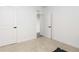 Empty room featuring a carpeted floor and two doors at 3074 Belleville Ridge Rd, Elizabeth, CO 80107