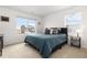 Bedroom with a large window, plush carpet and a well-made bed at 3074 Belleville Ridge Rd, Elizabeth, CO 80107